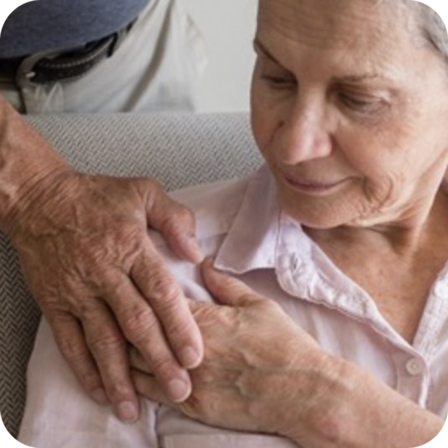 A person resting there hand on another persons shoulder