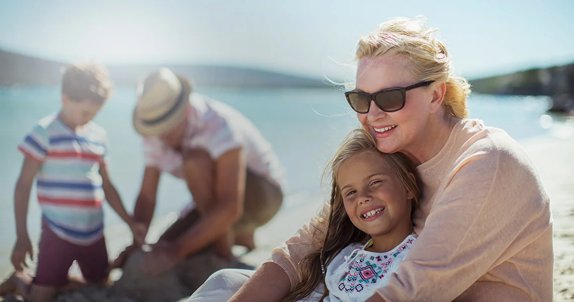 a person and a child on a beach