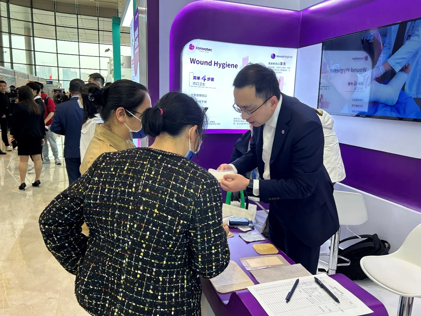 a man and woman looking at a phone