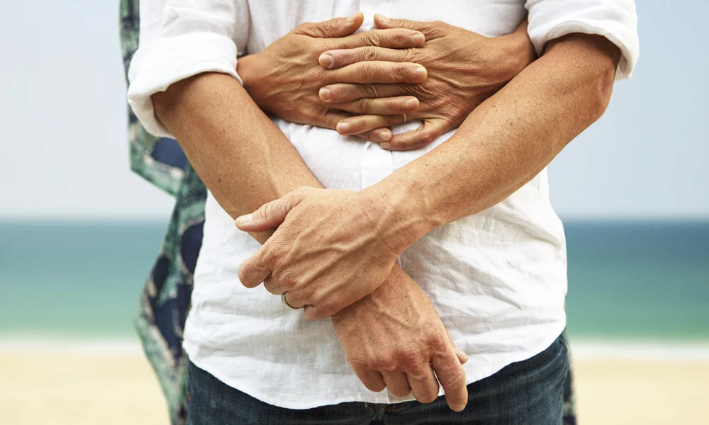 a close-up of people holding hands