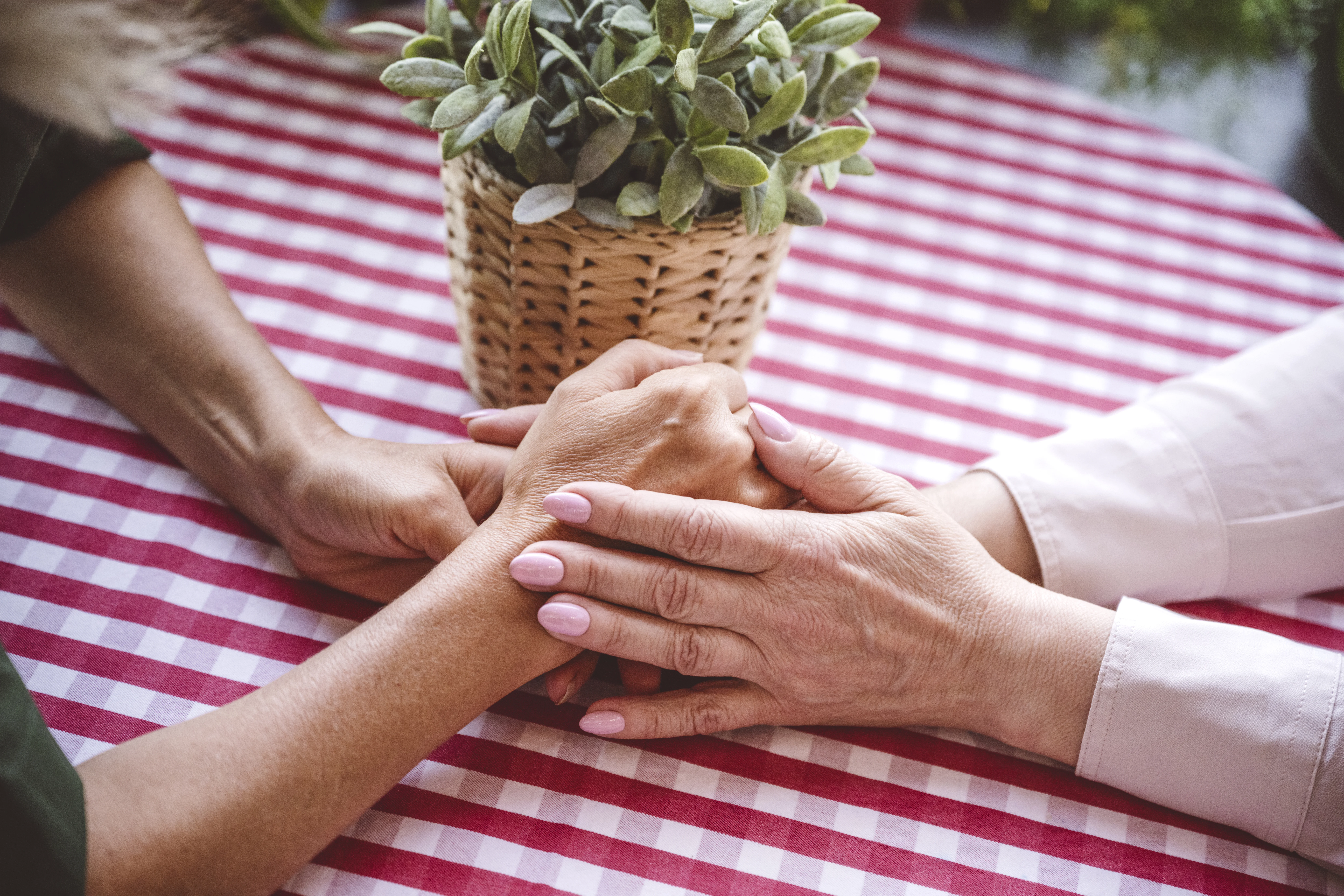 a group of people holding hands