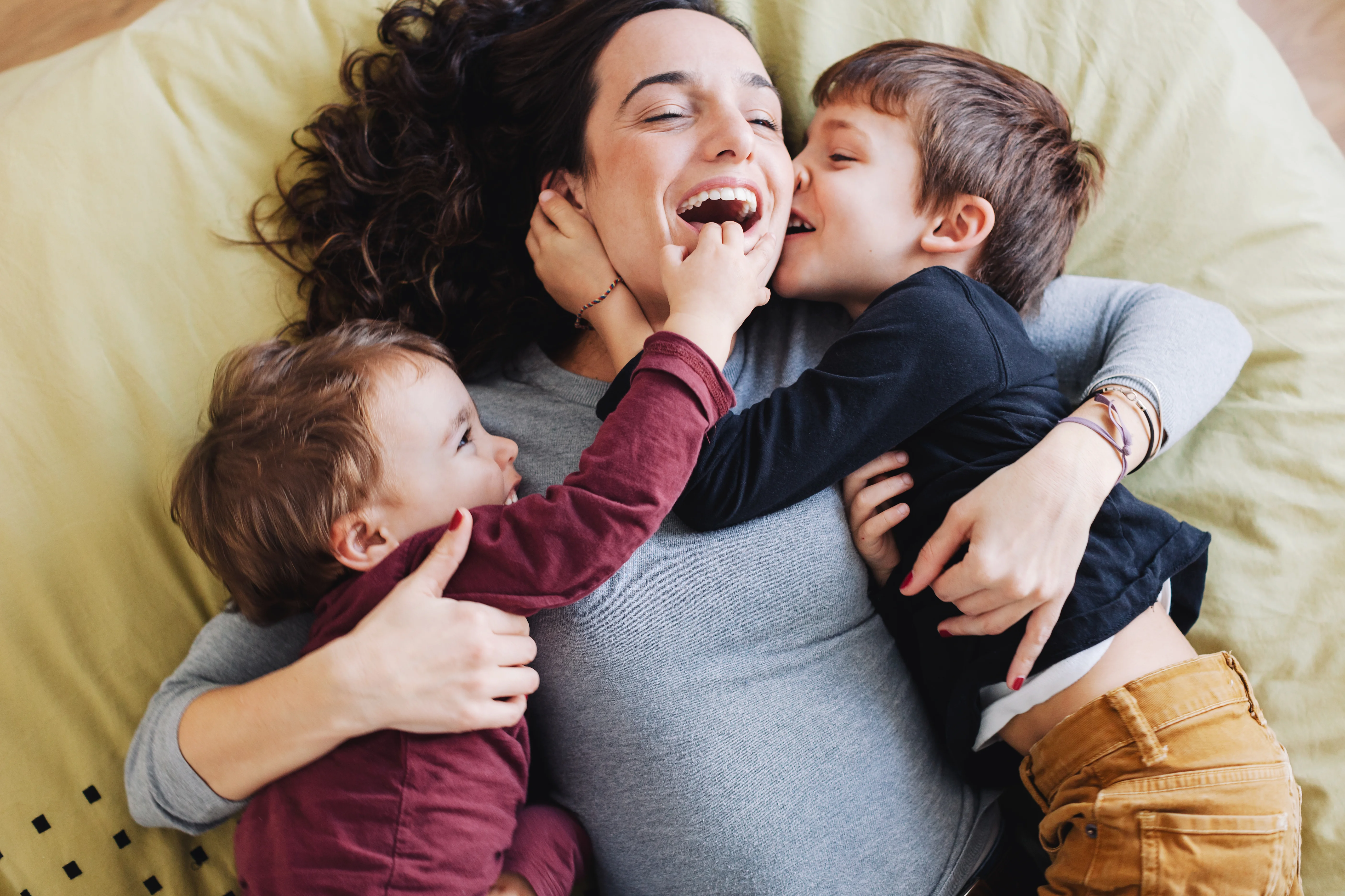 a person holding a couple of children