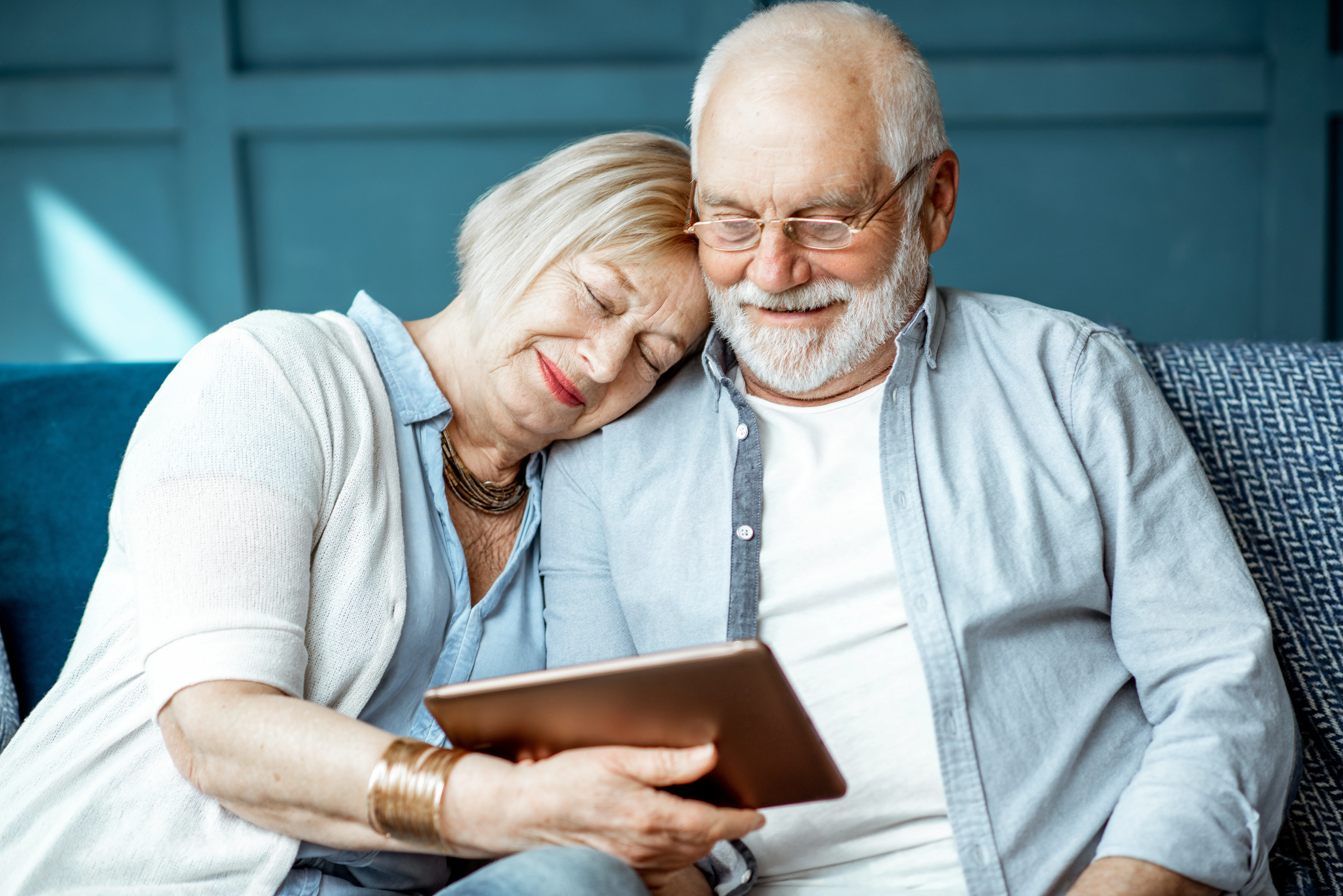 a man and woman looking at a book