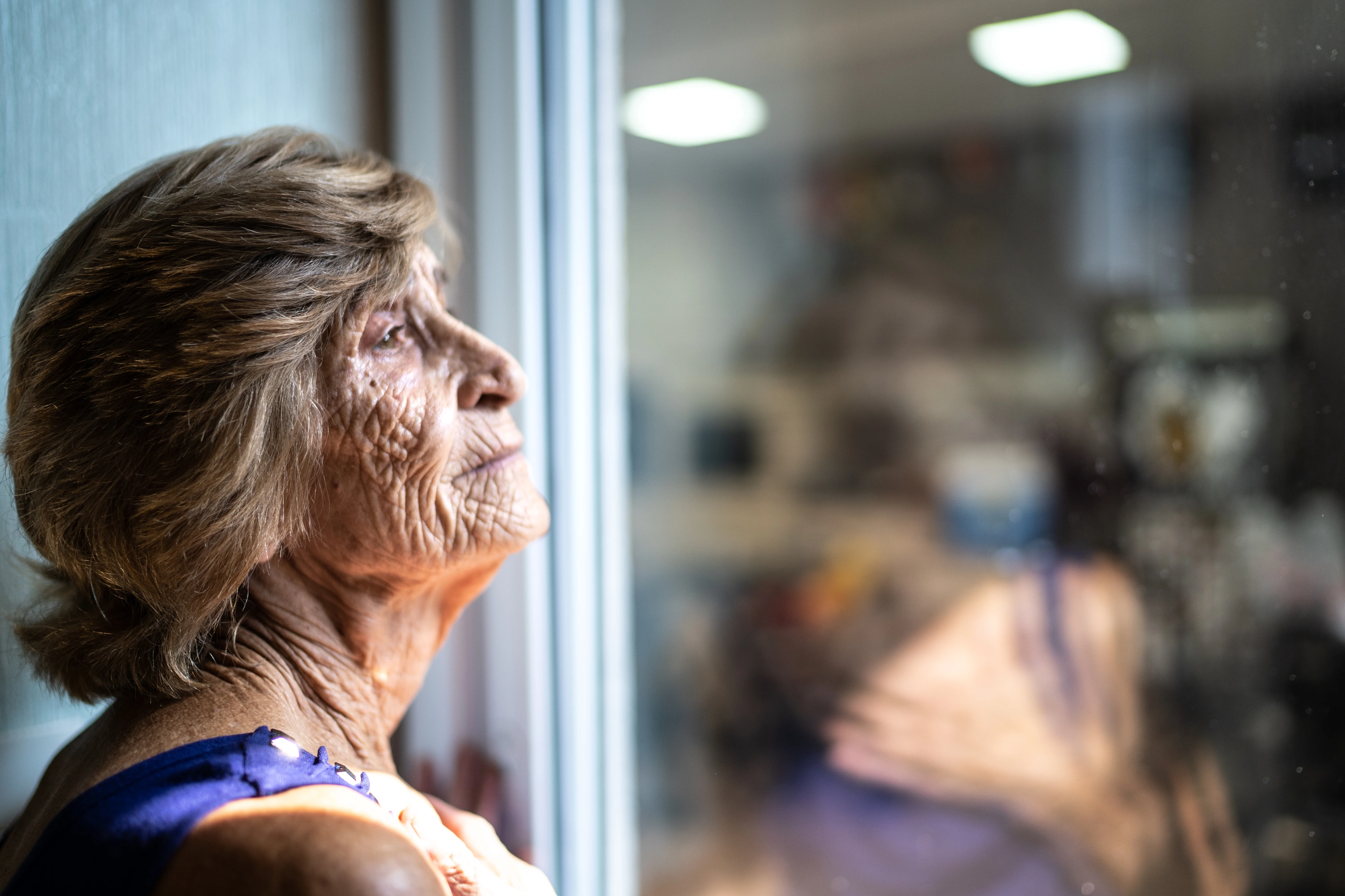 a person looking out a window
