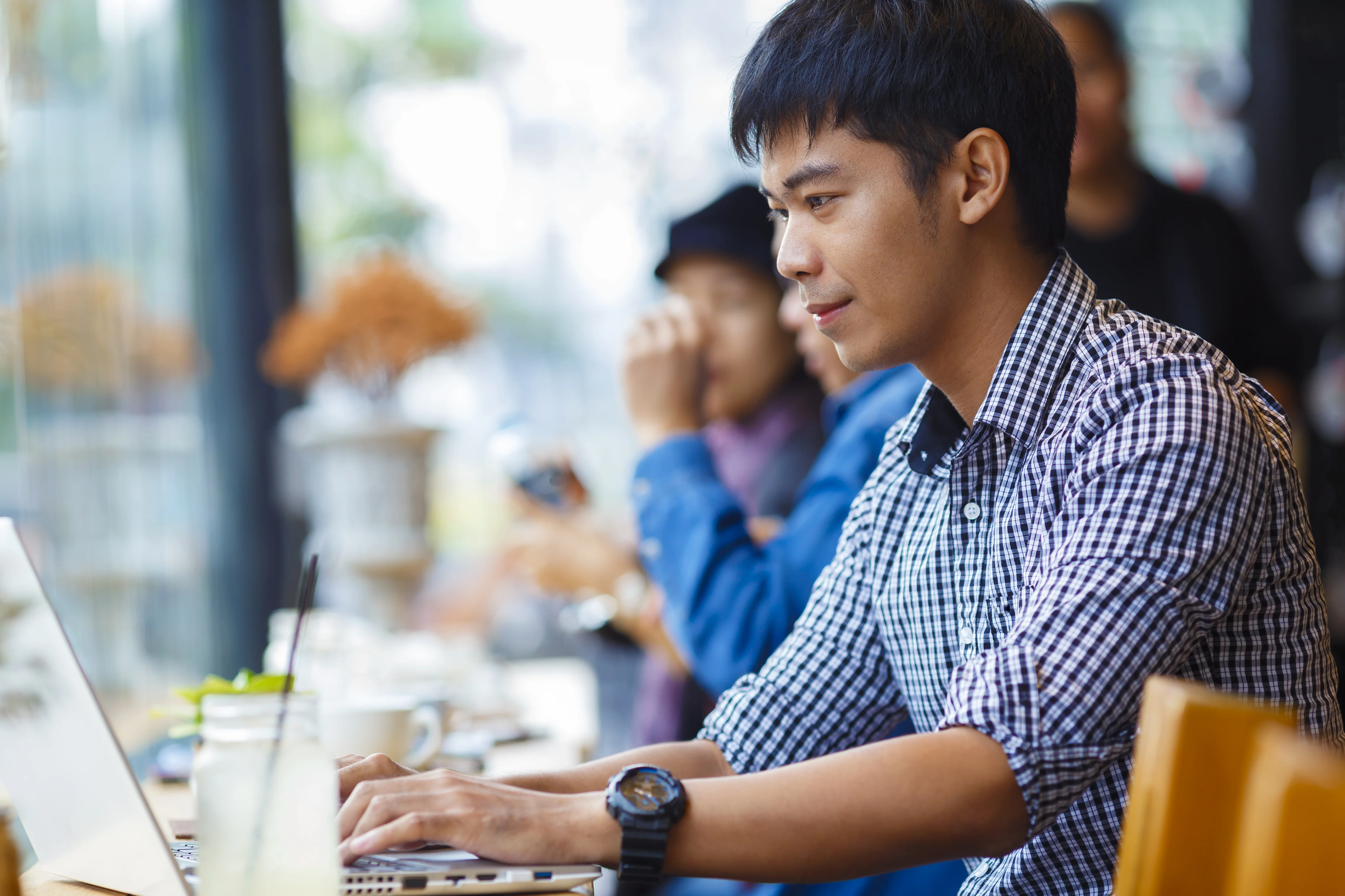 a person looking at a laptop