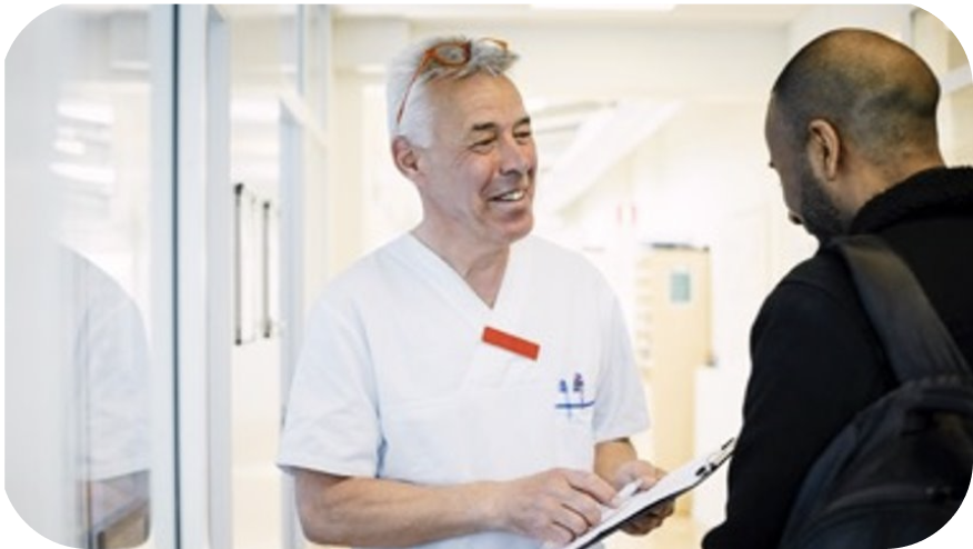 A medical worker looking at another person